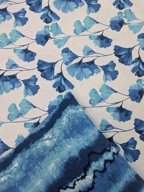 Close-up of Aqua Bloom Waves blue and white bedsheet fabric by Ahmed Collection